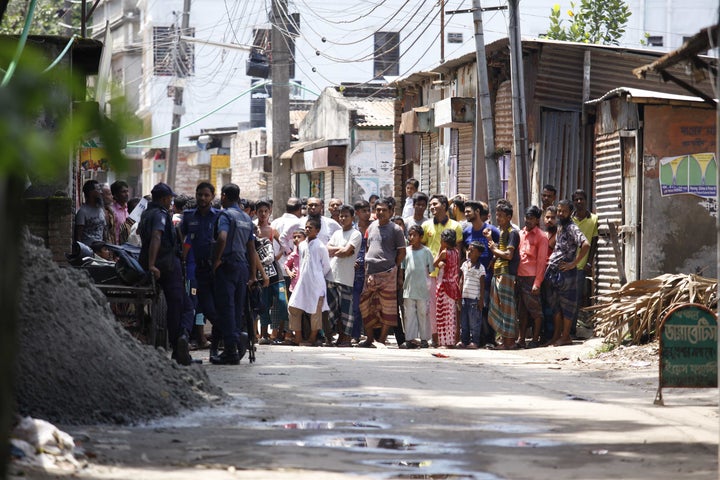 Bangladesh police attend the scene of an operation where they stormed a militant hideout in Narayanganj, around 25 kms south