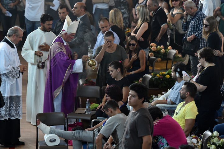 Giovanni D'Ercole Bishop of Ascoli Piceno performs a blessing during a funeral mass for victims of the recent earthquake on A