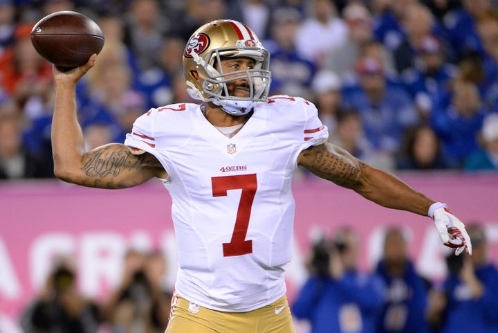 San Francisco 49ers quarterback Colin Kaepernick (7) throws the ball against the New York Giants in the second quarter at MetLife Stadium.