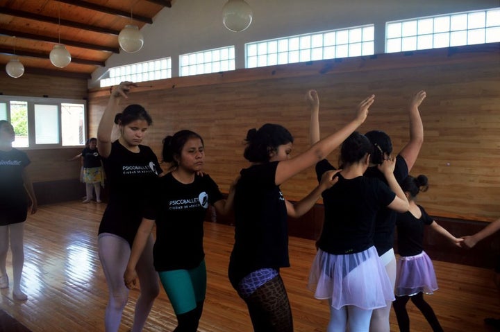 The girls rehearse part of a dance during class.