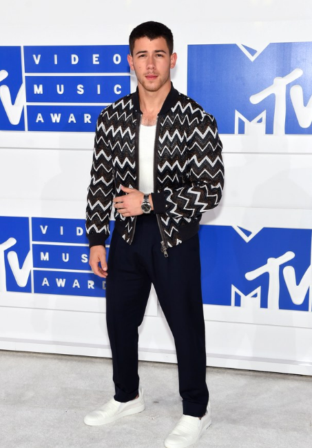 If you want the Cliffs Notes on what’s happening in menswear at the moment look at Nick Jonas’s higher-waist pants, low-cut undershirt, and macho Louis Vuitton bomber.