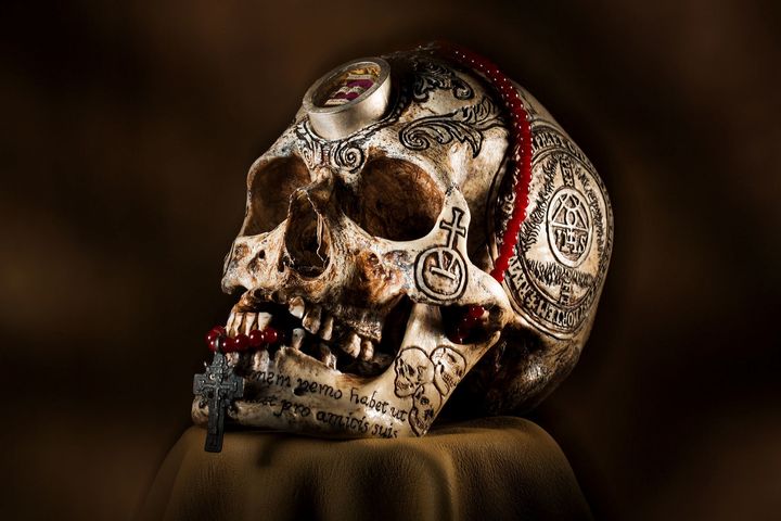 Artist Zane Wylie carved this human skull and embedded a relic from Saint Aloysius Gonzaga, who died while helping plague victims in Rome in the 1500s. The piece sold for $8,575.