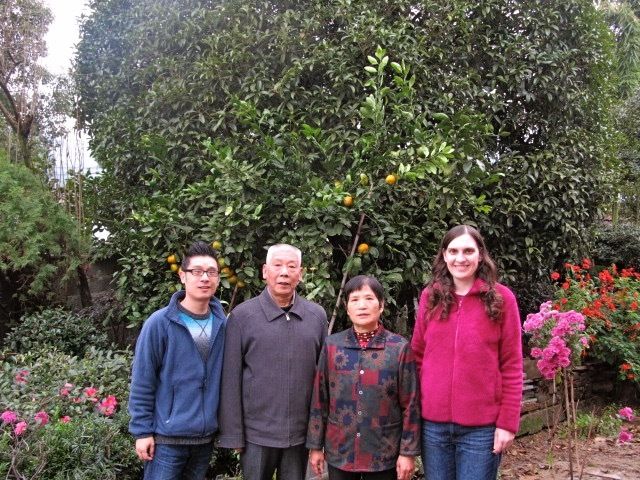 A family photo with my husband Jun Yu (far left) and his parents in front of their home in China.