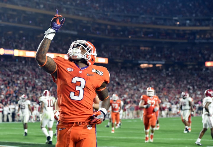 Clemson Tigers wide receiver Artavis Scott celebrates after scoring a touchdown against the Alabama Crimson Tide in the fourth quarter in the 2016 CFP National Championship in January.