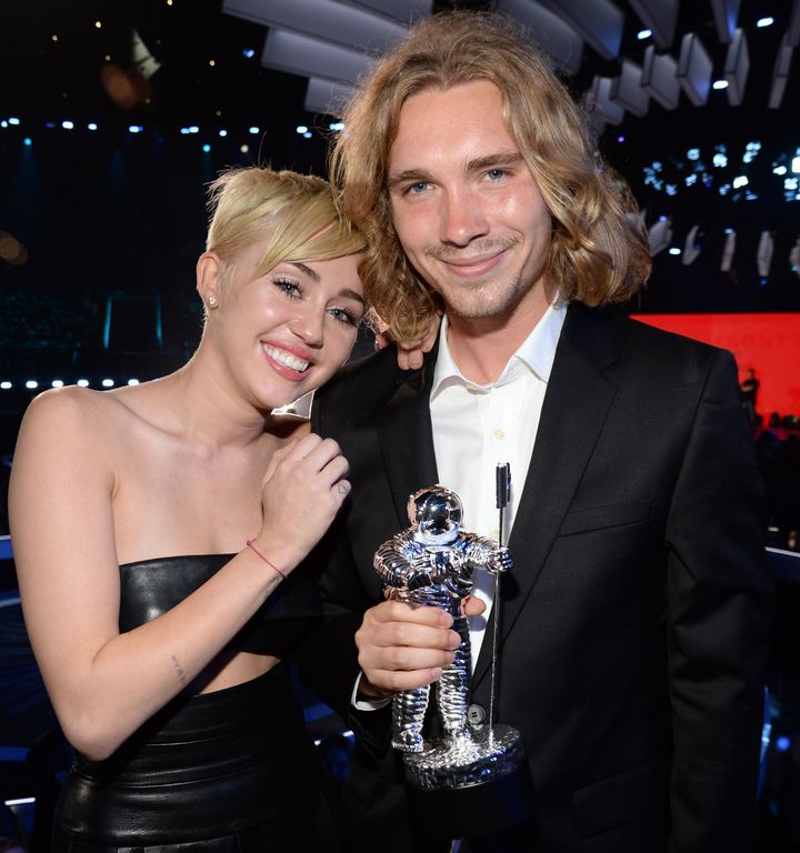 Miley Cyrus and Jesse Helt attend the 2014 MTV Video Music Awards. 