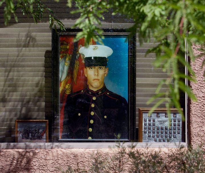 A portrait of Marine Jose Guerena Ortiz sits on display in the window of his home in Tucson, Arizona. 