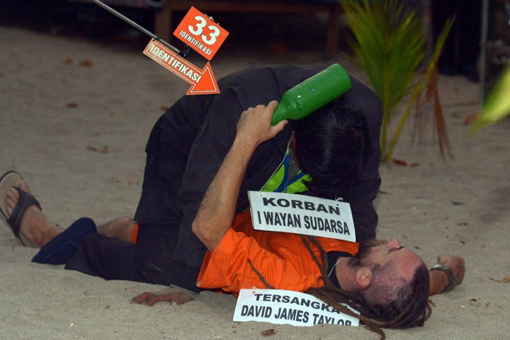 With the victim played by another police officer, the pair appeared to tussle, with British Taylor seen holding a beer bottle 