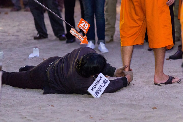 <strong>The 'victim' is seen grasping onto Taylor's ankle </strong>