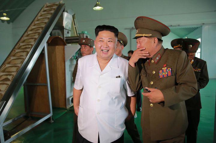 North Korean leader Kim Jong-Un (2nd R) inspecting a fish food factory in July of this year.