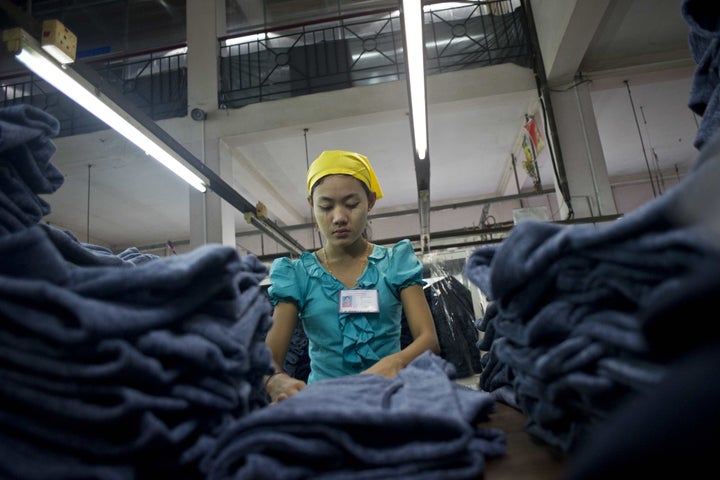 A woman works at the Shweyi Zabe garment factory in Shwe Pyi Thar Industrial Zone in Yangon on Sept. 18, 2015.