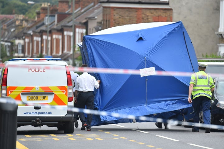 Police at the scene in Lennard Road, Penge in in south-east London.