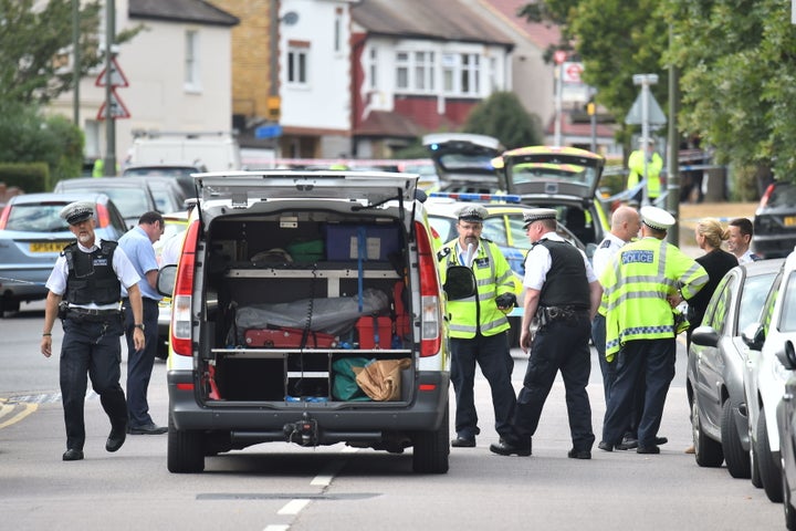 Police at the scene in Lennard Road, Penge in in south-east London.