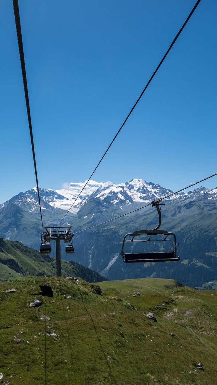 Snow capped mountains become lush green meadows.