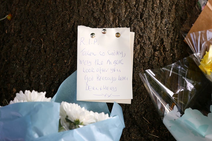 <strong>Flowers and a note left in tribute at the scene</strong>