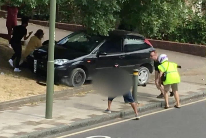 Passers-by rush to the scene of the crash