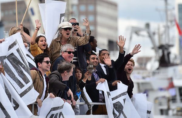 A boat carrying supporters for the Remain in the EU campaign including Sir Bob Geldof (C) shout and wave at Brexit fishing boats as they sail up the river Thames.