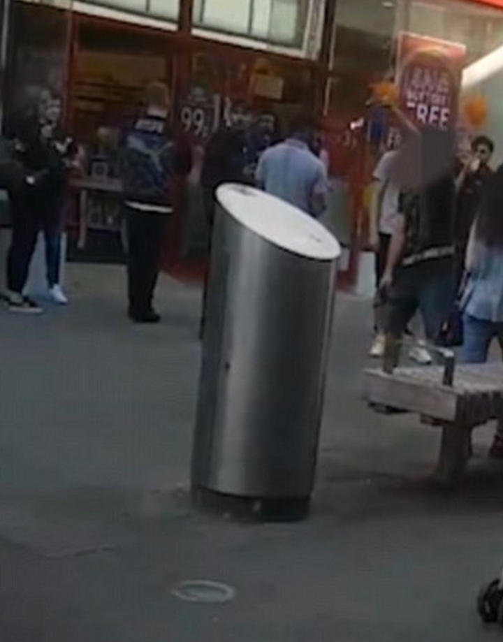 <strong>The man pictured right with his face pixilated can be seen shouting abuse</strong>