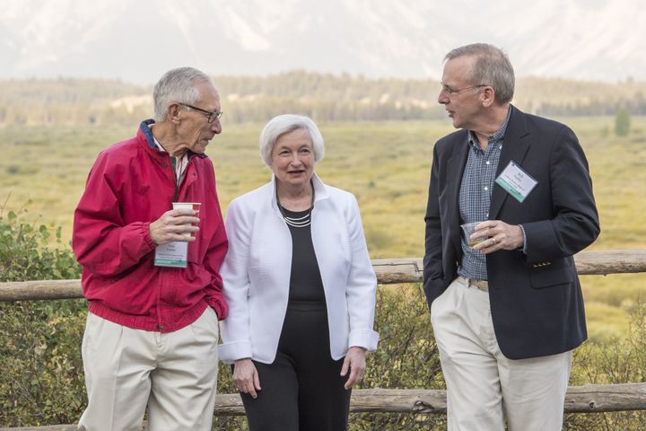 Stanley Fischer, vice chairman of the U.S. Federal Reserve, left, Janet Yellen, chair of the U.S. Federal Reserve, center, and William Dudley, president and chief executive officer of the Federal Reserve Bank of New York, walk outside during the Jackson Hole economic symposium in Moran, Wyoming, U.S., on Friday, Aug. 26, 2016.