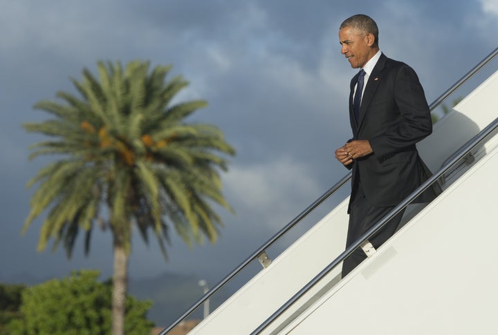 President Barack Obama disembarks from Air Force One in Honolulu, Hawaii, on Wednesday. He'll head to the remote Midway Atoll on Thursday.