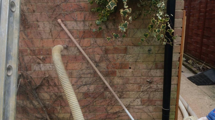 Cavity wall insulation - blowing insulation material into cavity