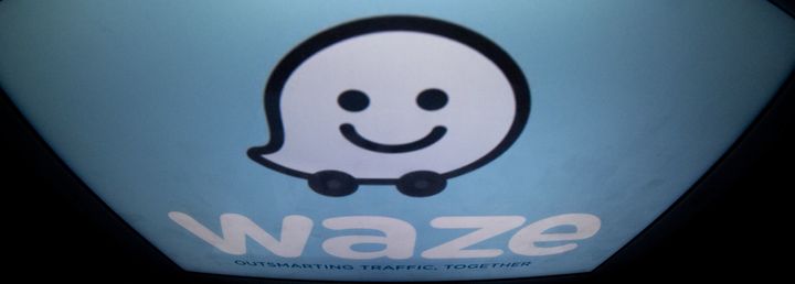The Waze logo is displayed on a tablet, Jan. 2, 2014. The Alphabet-owned mobile app edged into Uber's territory this week.
