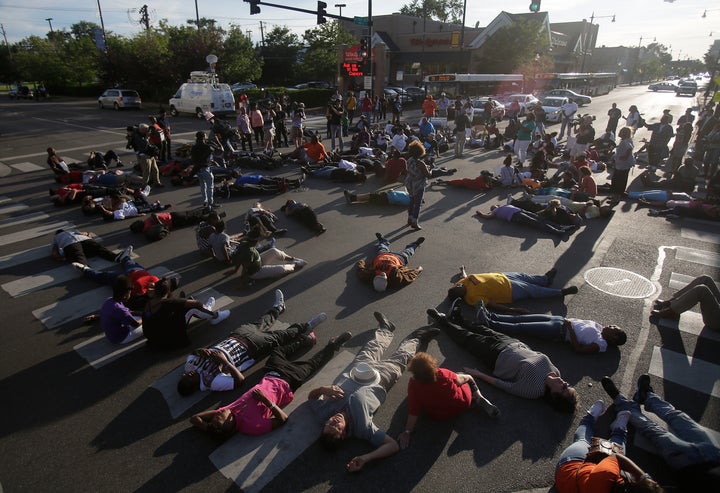 Demonstrators stage a sit-in as they protest the recent uptick in homicides across the city on Aug. 31 in Chicago. Chicago has seen over 80 people killed and over 400 people shot and wounded during the month of August, making it the most violent month in 20 years.