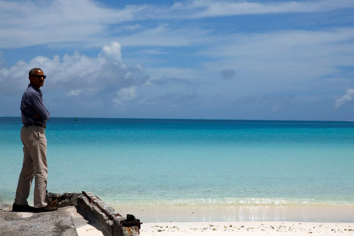 President Barack Obama looks out at Turtle Beach on a visit to the Papahanaumokuakea Marine National Monument on the Midway Atoll, September 1, 2016.