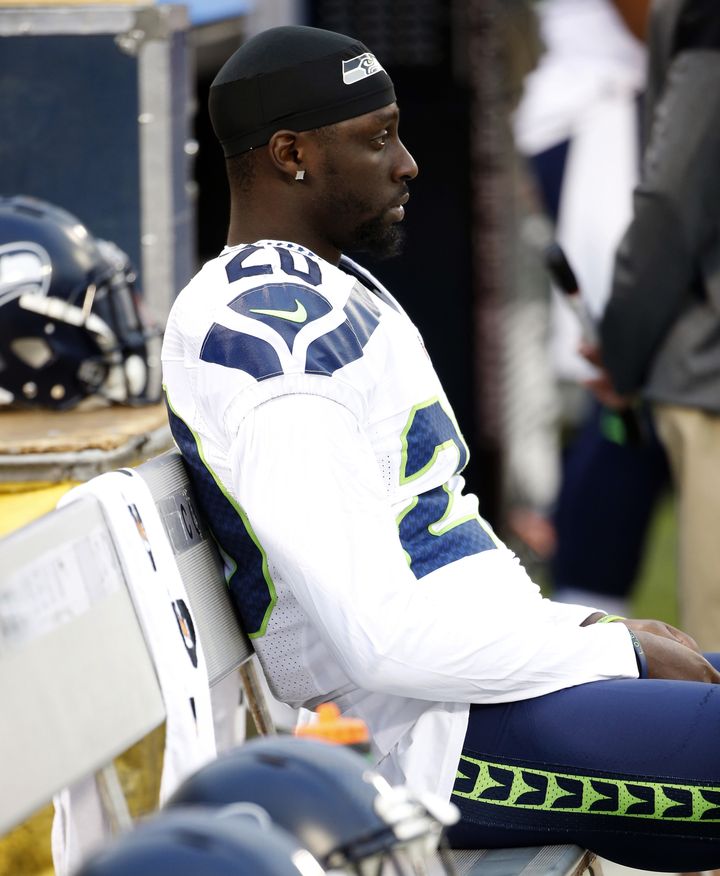 Jeremy Lane of the Seattle Seahawks sits as the national anthem plays during a preseason game in Oakland.