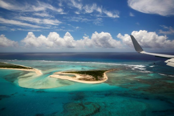 The wing tip of Air Force One can be seen as President Barack Obama lands at Henderson Field to visit the Papahanaumokuakea Marine National Monument, Midway Atoll, U.S. September 1, 2016.