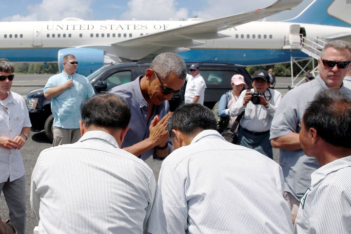 President Barack Obama greets workers after landing aboard Air Force One at Henderson Field to visit the Papahanaumokuakea Marine National Monument, Midway Atoll, U.S. September 1, 2016.