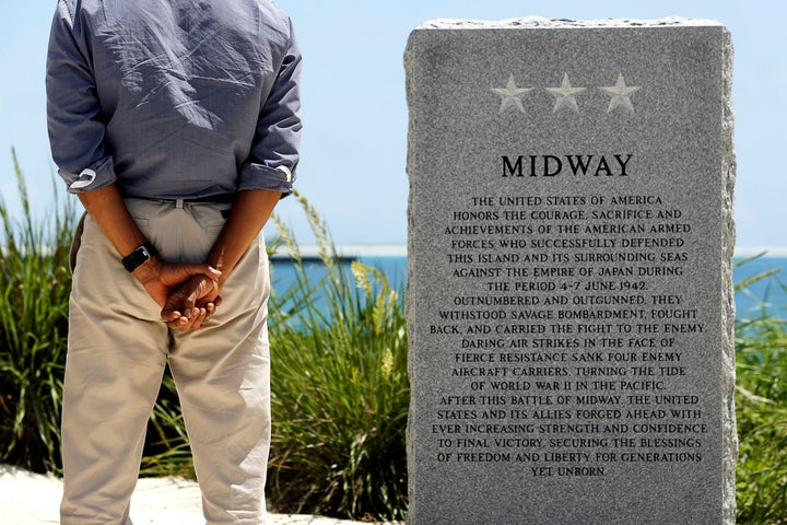 President Barack Obama pays his respects at a memorial to the Battle of Midway monument during a visit to the Papahanaumokuakea Marine National Monument, Midway Atoll, U.S. September 1, 2016.