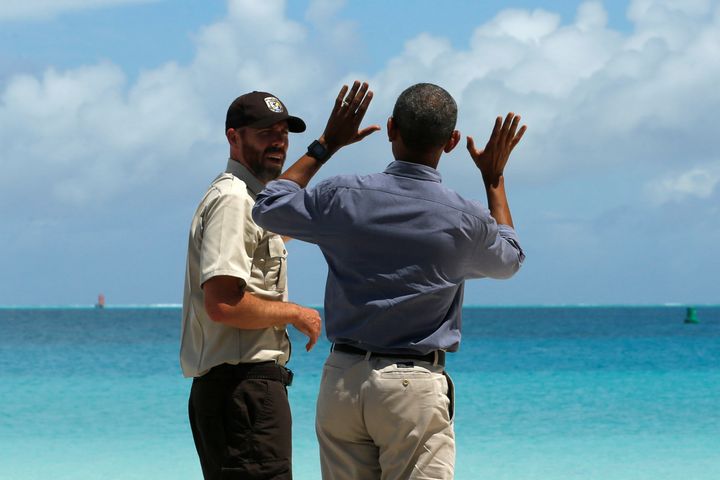 Marine National Monuments Superintendent Matt Brown (L) gives President Barack Obama at tour of the Papahanaumokuakea Marine National Monument, Midway Atoll, U.S. September 1, 2016.
