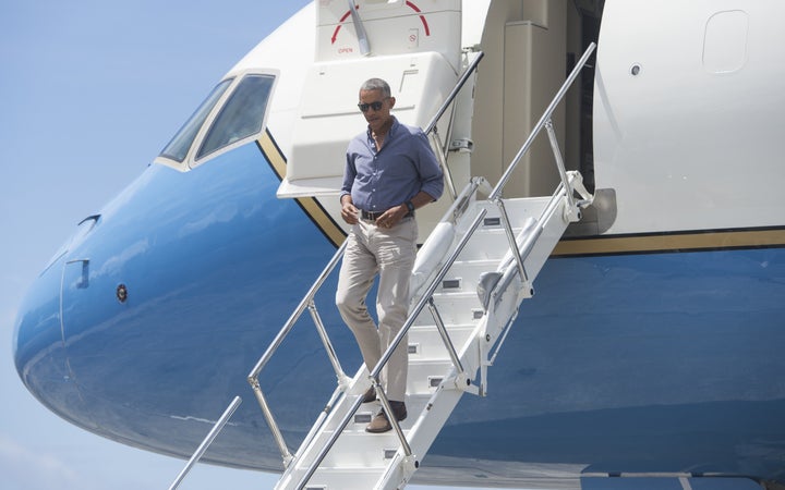 President Barack Obama disembarks from Air Force One upon arrival to tour Midway Atoll in the Papahanaumokuakea Marine National Monument in the Pacific Ocean, September 1, 2016.