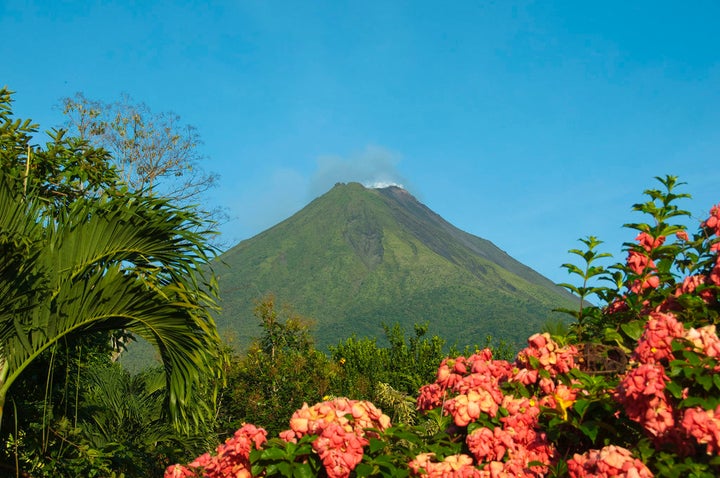 Wait for a cloud-free day to photograph the Arenal volcano’s perfectly triangular apex.