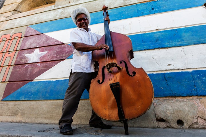 Traditional Cuban musician is played for tourists on the streets of Santiago de Cuba.