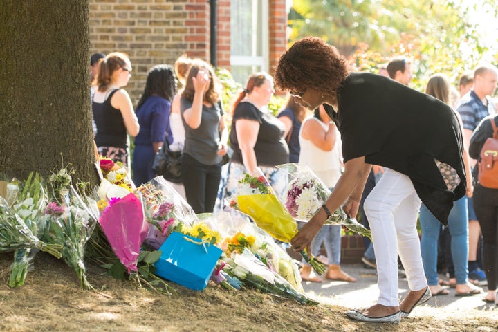 <strong>People lay flowers Lennard Road in Penge, south-east London.</strong>