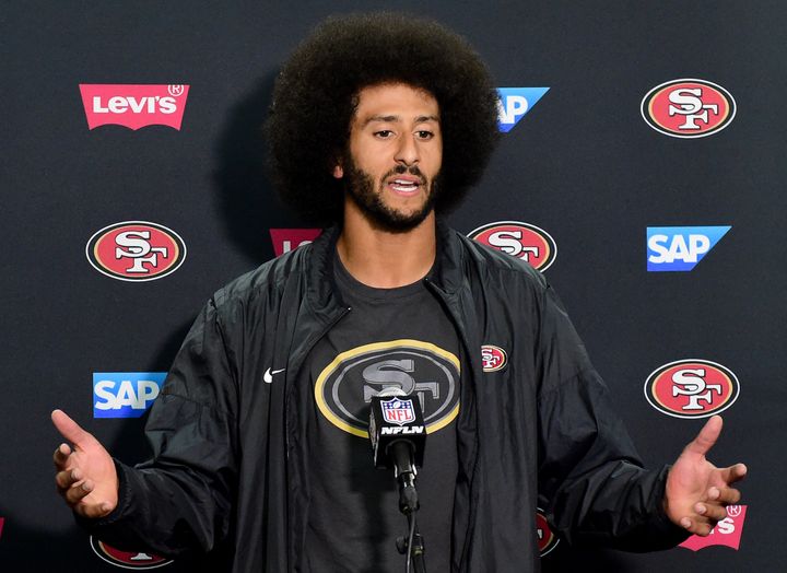 49ers quarterback Colin Kaepernick addresses the media on Thursday night. During the press conference, he said he would donate $1 million to needy communities. 