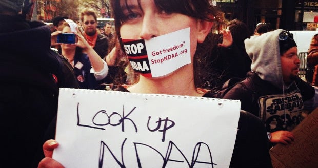 A protester questions the NDAA’s place in American law (source)