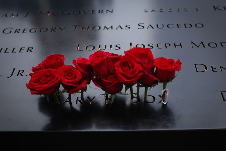 Roses are seen placed on the 9/11 memorial.