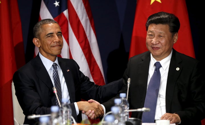 U.S. President Barack Obama shakes hands with Chinese President Xi Jinping during their meeting at the start of the climate summit in Paris November 30, 2015.