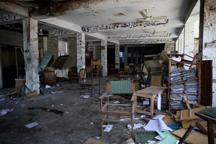 An inside view of a courthouse after a suicide bomber attacked a court in the northern Pakistani city of Mardan, killing at l