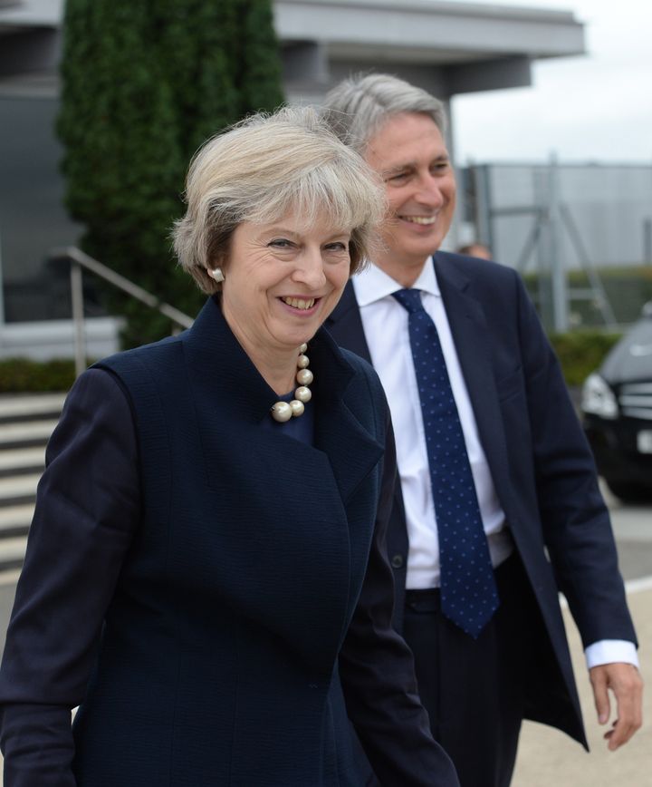 <strong>Prime Minister Theresa May and Philip Hammond at Heathrow Airport before she boards a plane for the G20 Summit in China </strong>