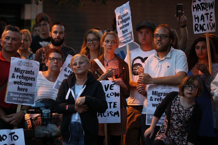People attend a vigil in Harlow to pay tribute to Arkadiusz Jozwik