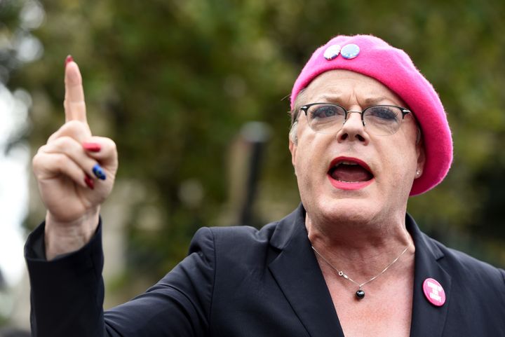 Police have charged a man with theft after Eddie Izzard's hat was taken