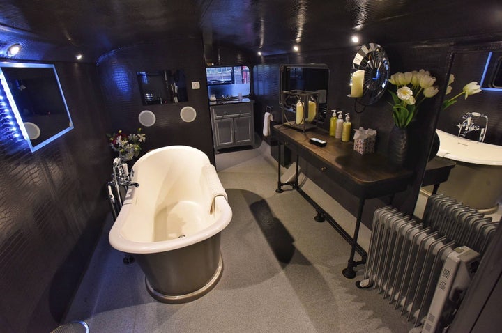 The bathroom complete with a roll top bath.