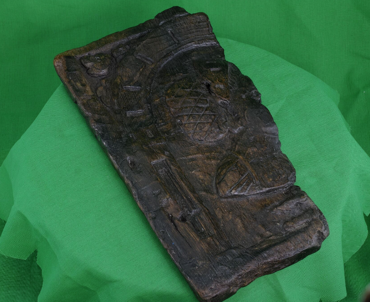 <strong>An ornately engraved wooden panel </strong>