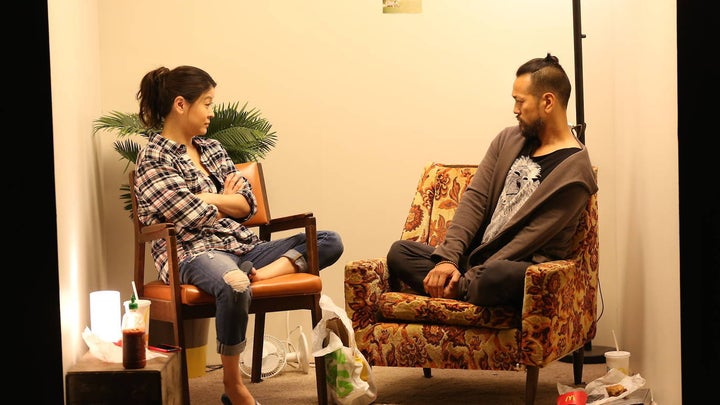 Who are these people? They’re Jennifer Lim and Louis Ozawa Changchien, but they’re pretending to be Wang Min and Lin Bo, and who are <em>they</em>? And why are they in a box?
