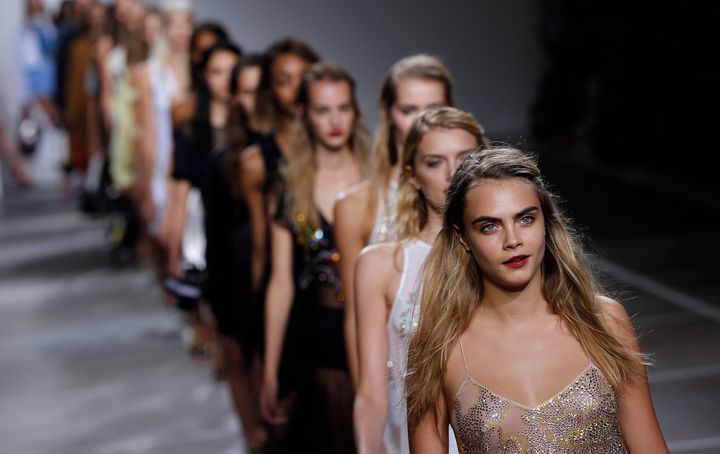 Models walk the runway at London Fashion Week