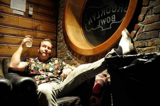 Reel Big Fish singer and guitar player Aaron Barrett makes himself at home in the Brooklyn Bowl green room on February 2.