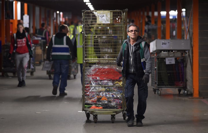 Staff in the warehouse during a tour of the Sports Direct headquarters in Shirebrook, Derbyshire